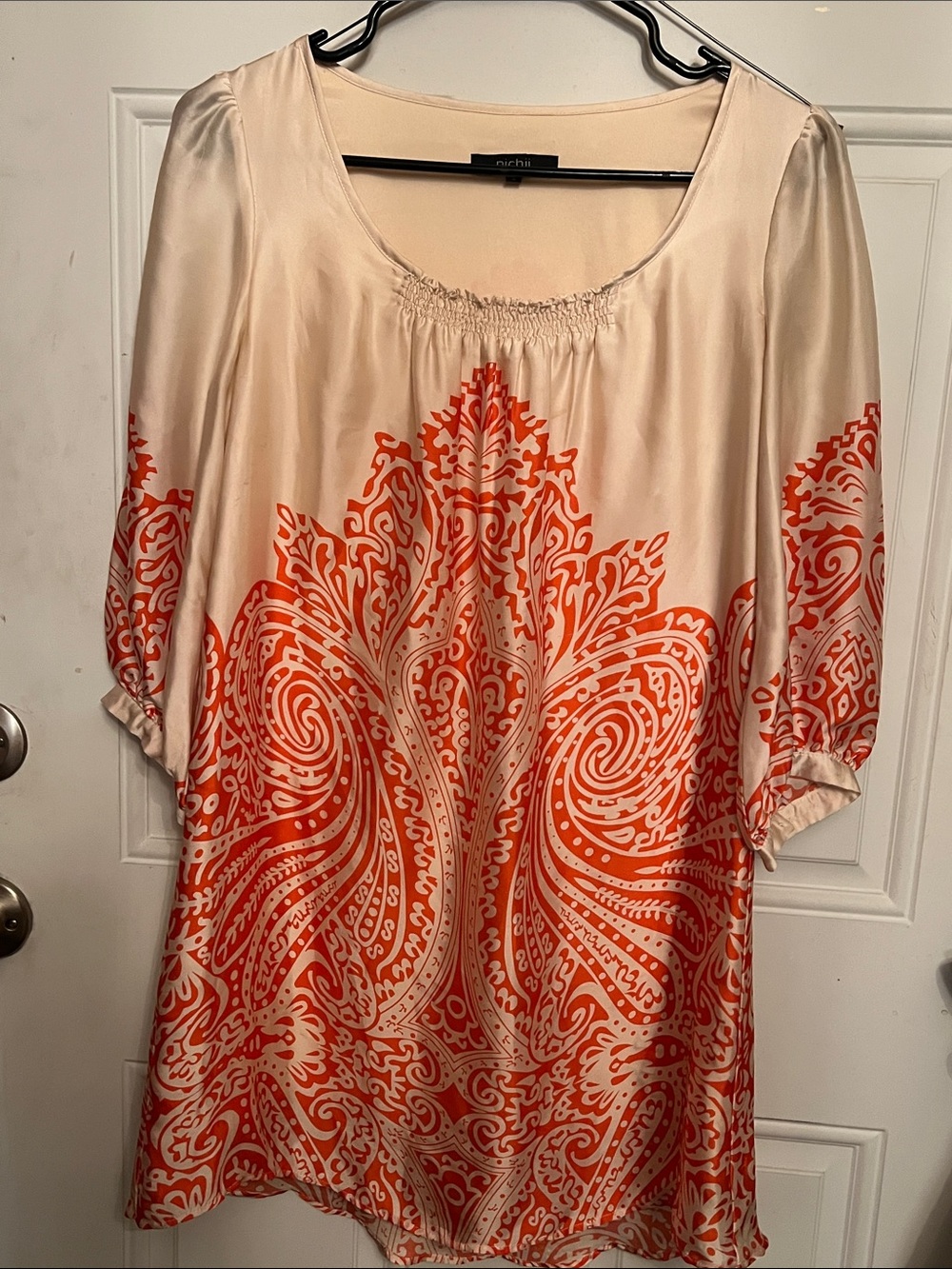 Oichi Cream Tunic with Vibrant Orange Paisley Motif